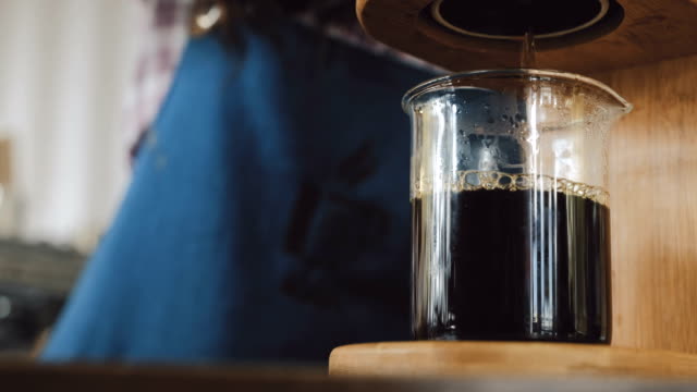 Coffee-dripping-into-a-glass-cup