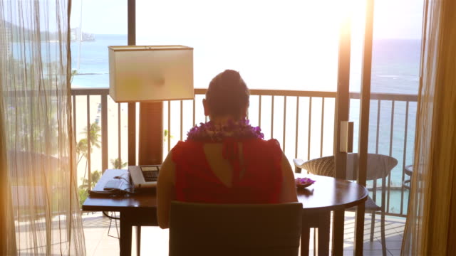 Woman-working-in-paradise-office-in-4k-slow-motion