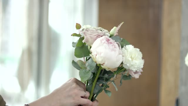 Young-Florist-Assembles-a-Bouquet