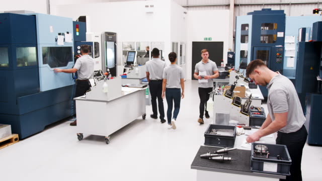 Busy-Engineering-Workshop-With-Workers-Using-CNC-Machinery