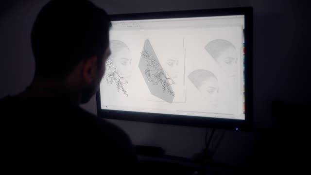 Diseñador-gráfico-concentrado-utilizando-computadora-y-trabajando-en-dibujo