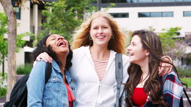 Portrait-Of-Female-High-School-Students-Outside-College-Buildings