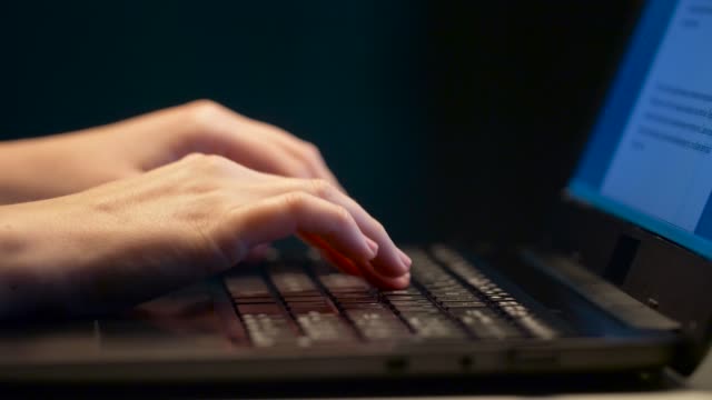 close-up-of-female-hands-with-laptop-typing