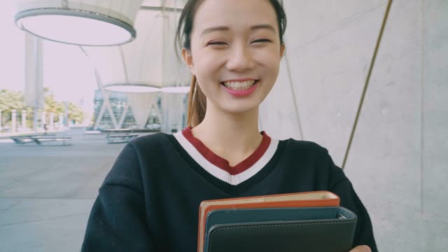 Young-Aspiring-Chinese-Student-with-books