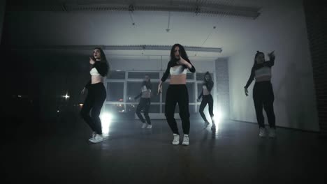 Group-of-young-hip-hop-dancers-performing-on-the-stage.-Happy-dancing-women.