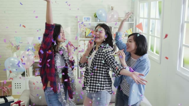 music-women-chilling-in-colorful-confetti-party