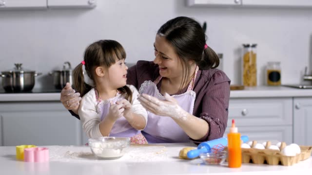 Family-with-special-needs-kid-preparing-bakery
