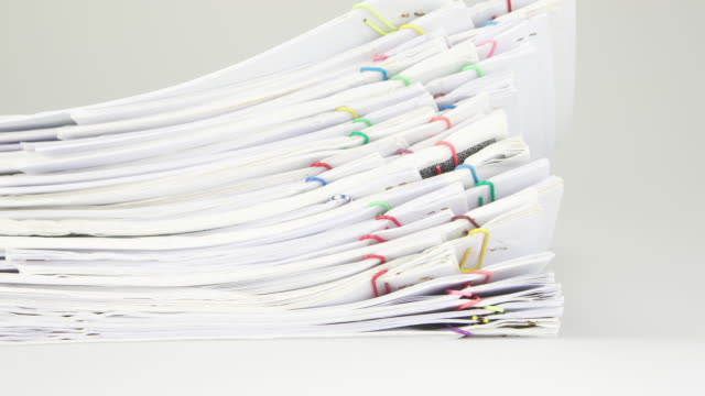 Sort-pile-of-paper-of-report-and-paperwork-time-lapse