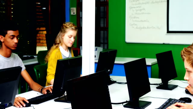 Students-studying-on-computer-in-classroom