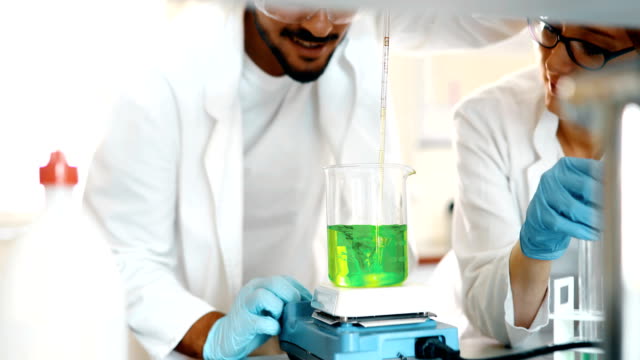 Attractive-student-of-chemistry-working-in-lab