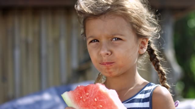 Girl-enjoying-watermelon