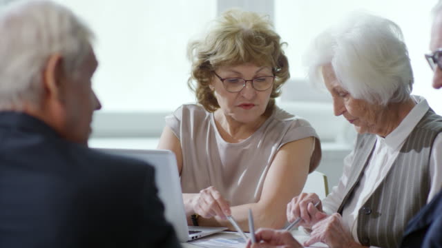 Elderly-Entrepreneurs-Discussing-Work-on-Meeting