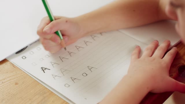 Little-girl-preparing-her-English-homework