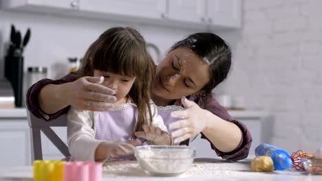 Mom-and-child-with-down-syndrome-playing-with-flour