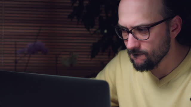 4K-Corporate-Shot-of-a-Business-Man-Working-on-Computer-and-Thinking