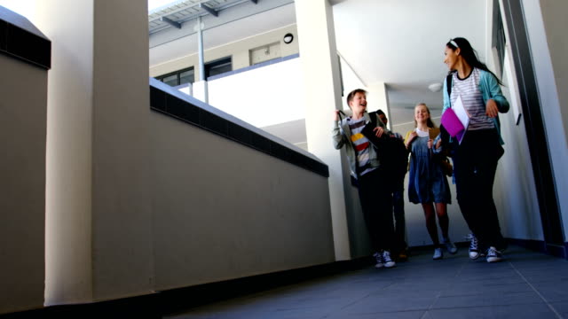 Group-of-classmate-running-in-corridor