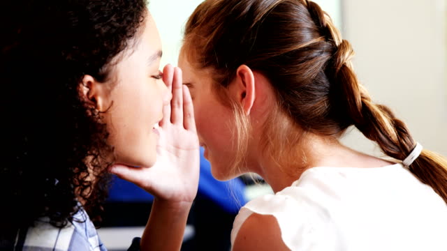 Students-gossiping-during-class-in-classroom