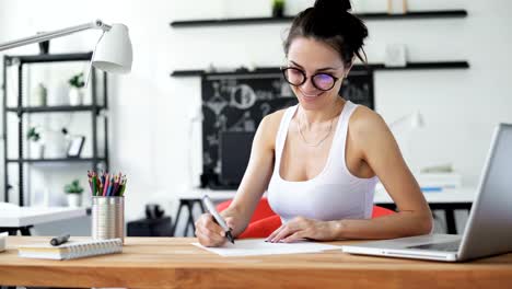 Cute-woman-working-in-trendy-office