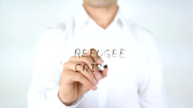 Refugee-Crisis,-Man-Writing-on-Glass