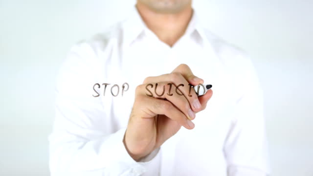 Stop-Suicide,-Man-Writing-on-Glass