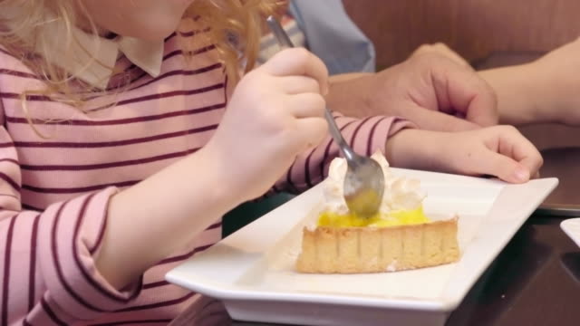 Little-Girl-Enjoying-Sweet-Cake