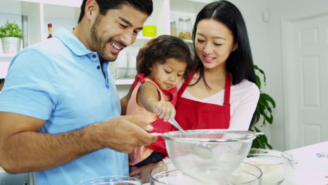 Asian-Chinese-parents-infant-daughter-home-kitchen-baking