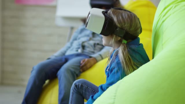 Little-Girls-Using-VR-Glasses-at-Lesson