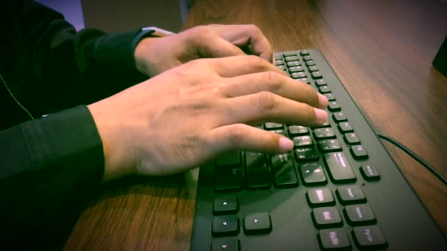 Close-up-hand-typing-keyboard