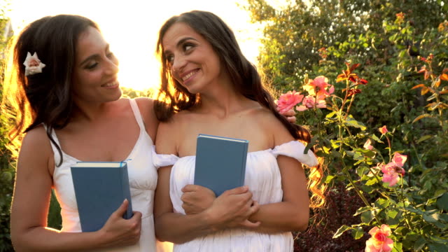 Two-sisters-outdoors-with-books