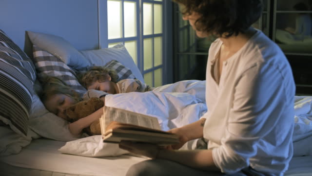 Mother-Reading-to-Children-Before-Sleeping