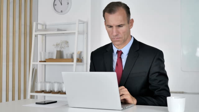 Businessman-Working-On-Laptop