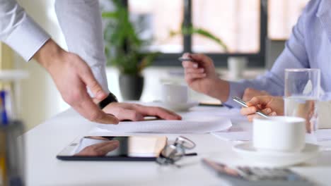 business-team-discussing-charts-at-office