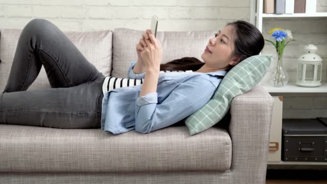 young-office-lady-tired-relaxing-lying-on-sofa