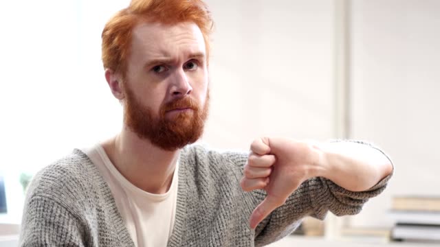Thumbs-Down-by-Man-with-Red-Hairs