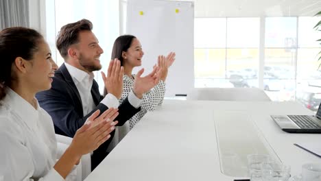happy-business-group-clapping-hands-In-slow-motion,-employees-applaud-in-office,-colleagues-near-desk