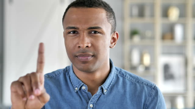 No,-Young-African-Man-Rejecting-Offer-by-Waving-Finger