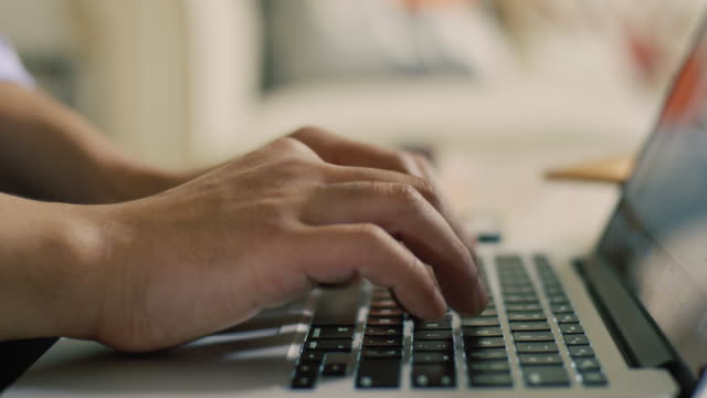 Closeup-of-Man-Typing-on-Laptop