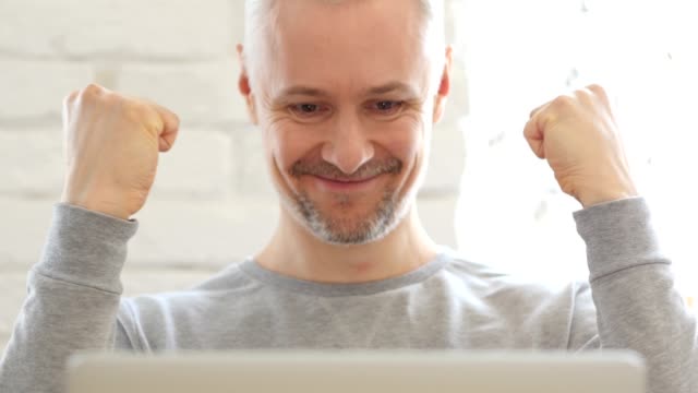 Middle-Aged-Man-Excited-for-Success-at-Work,-Front-View