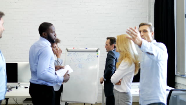 Group-Of-Business-People-Meeting-In-Boardroom,-Businesspeople-Team-Brainstorming-Together-In-Office