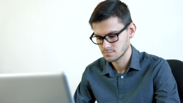 Young-man-working-on-a-computer