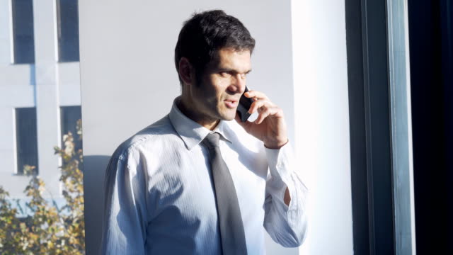 Businessman-talking-on-the-mobile-phone