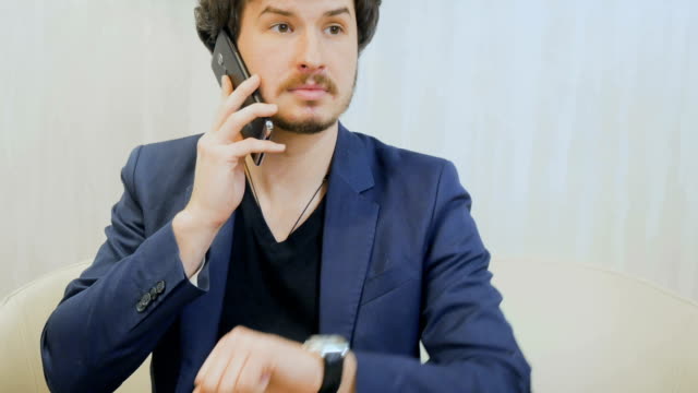 Businessman-talks-on-phone