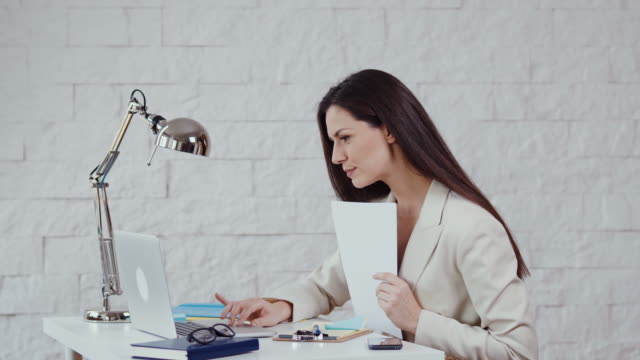 beautiful-young-businesswoman-working-with-documents