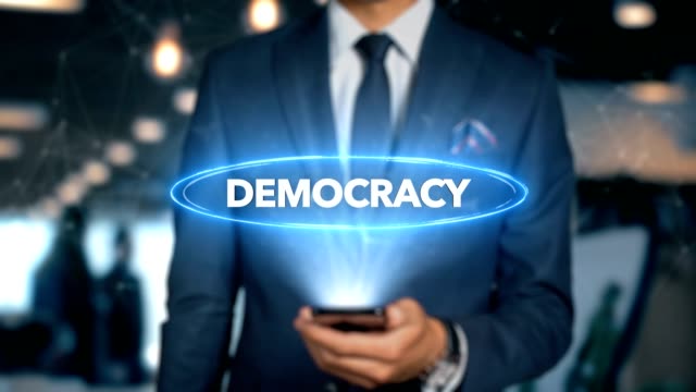 Geschäftsmann-mit-Handy-Hologramm-HUD-Interface-öffnet-und-berührt-Wort---Demokratie