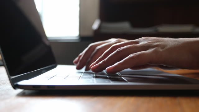 Closeup-hands-working-and-typing-on-laptop-keyboard