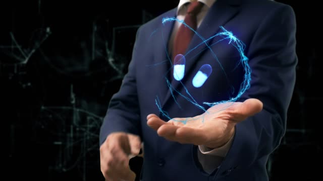 Businessman-shows-concept-hologram-3d-pills-on-his-hand