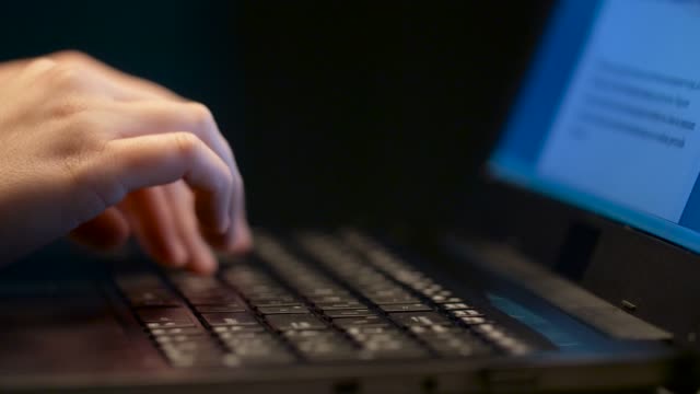 close-up-of-female-hands-with-laptop-typing