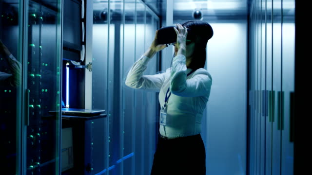 Woman-in-VR-glasses-working-in-data-center