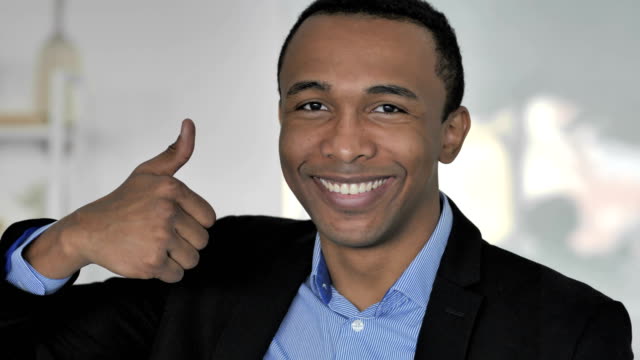 Thumbs-Up-by-Casual-Afro-American-Businessman-Looking-at-Camera
