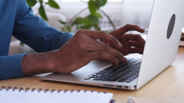 Businessman-typing-on-laptop
